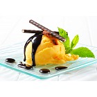 Ice cream with chocolate sauce and mint sticks